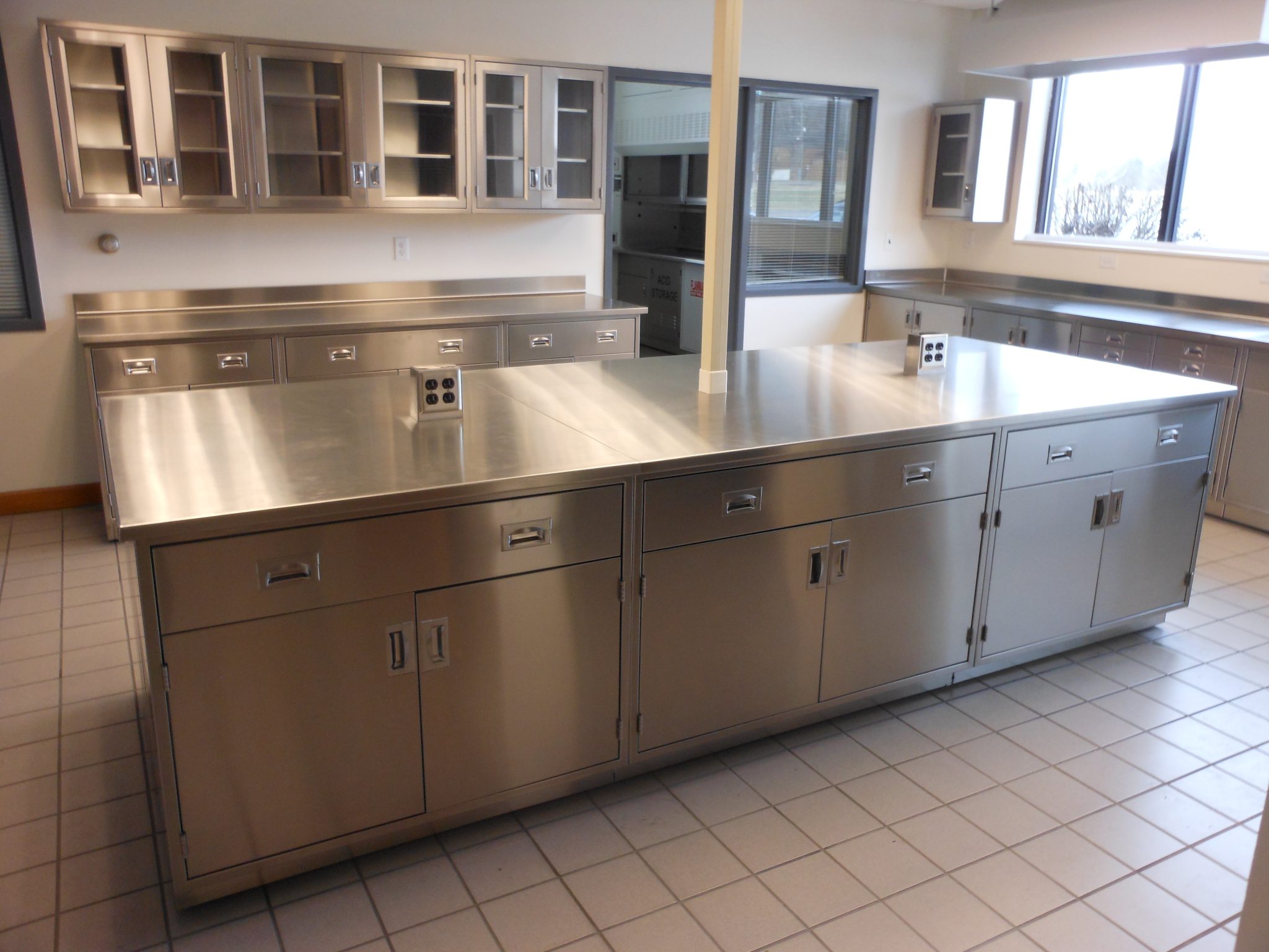Stainless Steel Casework - Stainless steel is a popular material for laboratory casework due to its strength, durability, and resistance to corrosion.